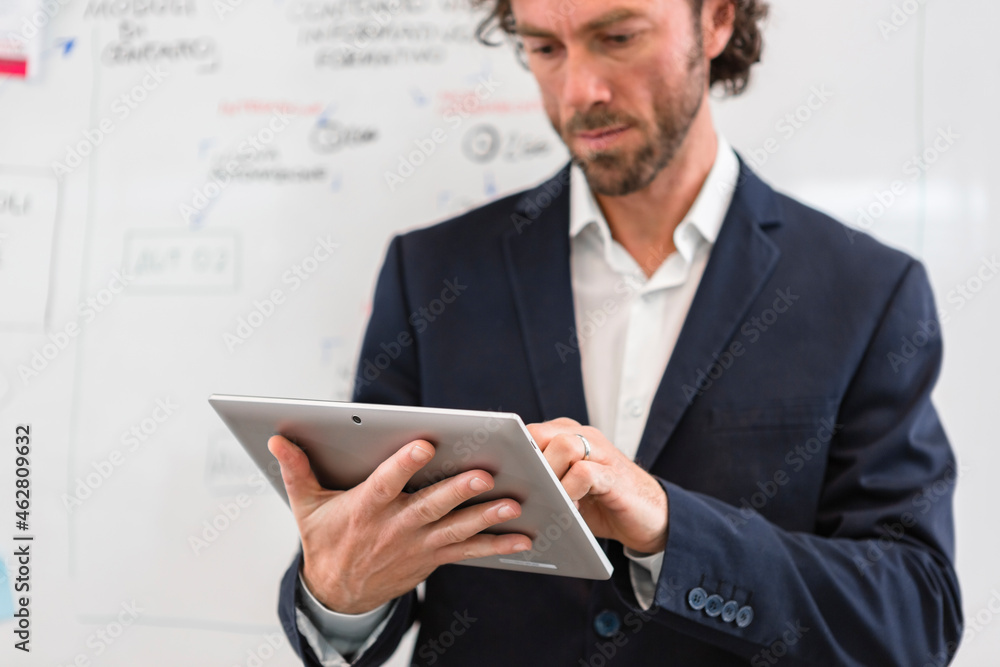 Businessman using tablet in office Businessman using tablet in office
