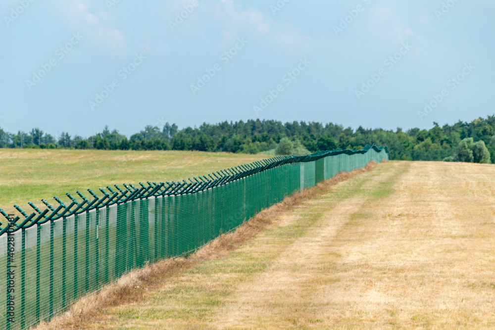 Security fence of an international airport in Poland.