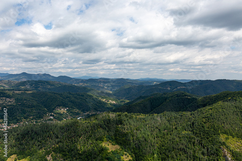 Fototapeta Naklejka Na Ścianę i Meble -  Mountain and forest with dramatic cloudy sky