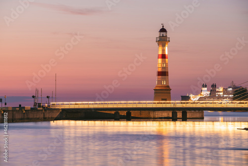 Wallpaper Mural Illuminated bridge over river with lighthouse in background against sky at Malmo, Sweden Torontodigital.ca