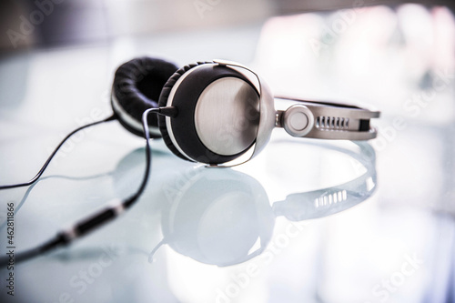 Headphones lying on glass table
