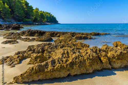 Rocks on the sand beach on Peljesac peninsula near Zuljana, Adriatic Sea, Croatia photo