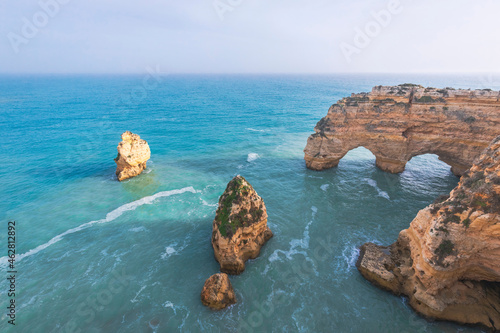 Portugal, Algarve, Lagoa, Praia da Marinha, rocky coastline and heart-shaped rock in the sea