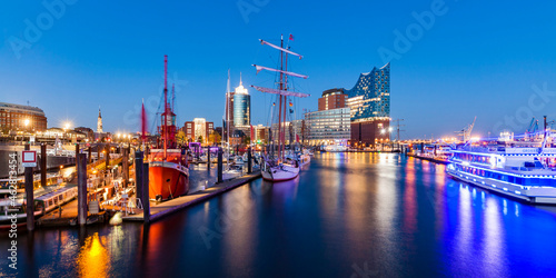 Germany, Hamburg, HafenCity, Elbe Philharmonic Hall and harbor at night photo