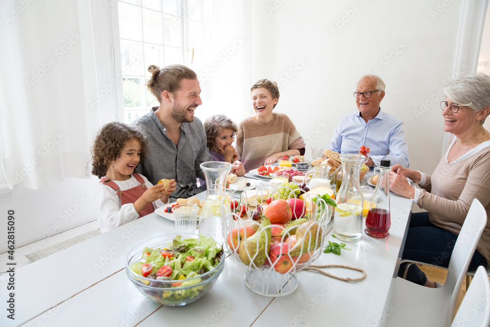 Happy extended family having lunch at home Happy extended family having lunch at home