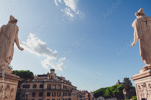 Italy, Rome, Castor statues against blue sky photo