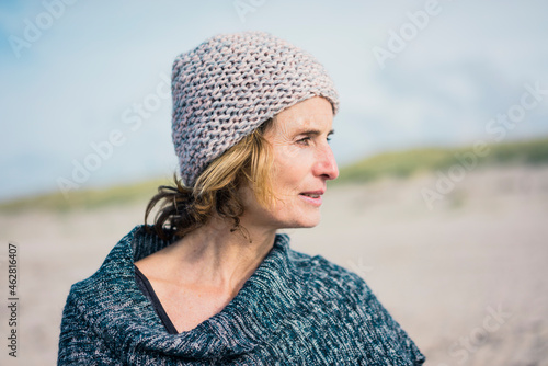 Mature woman, wearing wolly hat, portrait photo