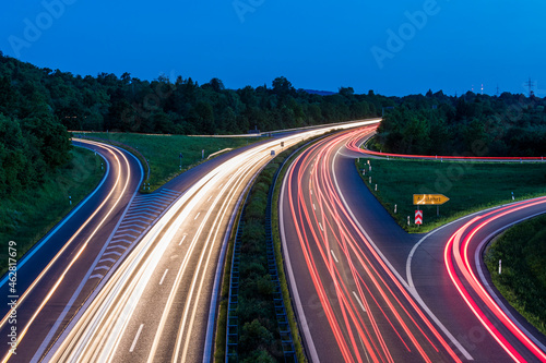 Germany, Baden-Wurttemberg, Blurred traffic lights on highway at dusk photo