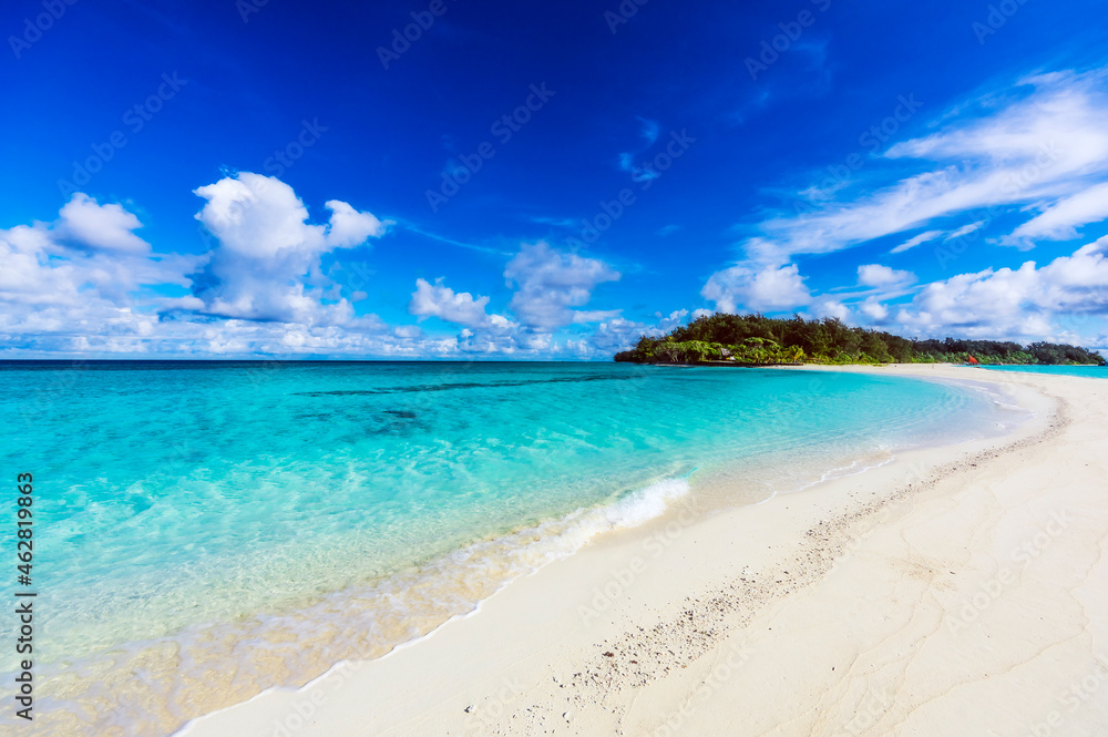 Papua New Guinea, Milne Bay Province, Blue sky over sandy coastal beach of Conflict Islands in summer Papua New Guinea, Milne Bay Province, Blue sky over sandy coastal beach of Conflict Islands in summer