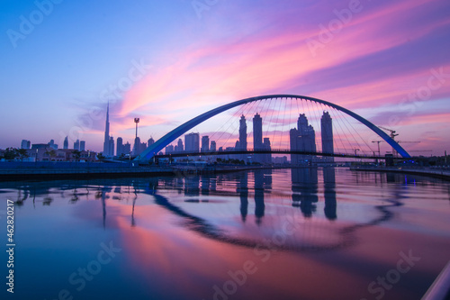 Fototapeta Naklejka Na Ścianę i Meble -  Beautiful Sunrise View of Tolerance Bridge in Dubai Canal
