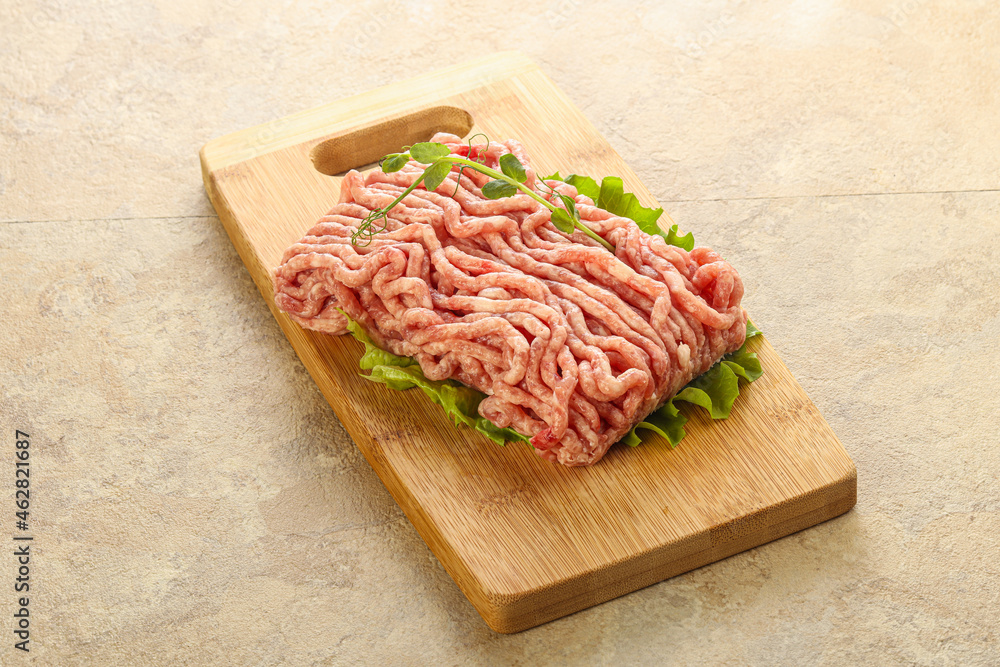 Raw minced pork meat over board Raw minced pork meat over board