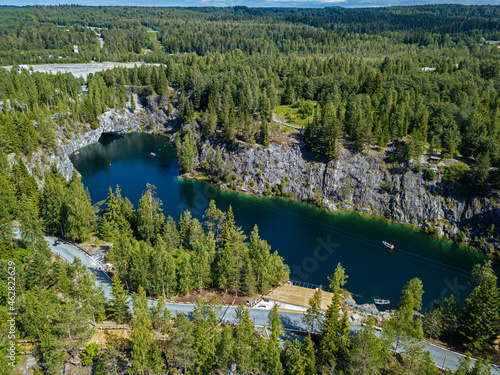 Russia, Republic of Karelia, Sortavala, Aerial view of green forest surrounding Marble Lake in summer photo