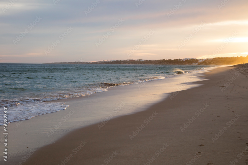 Scenic view of beach against sky during sunset, Atlantic Coast, Algarve, Portugal Scenic view of beach against sky during sunset, Atlantic Coast, Algarve, Portugal