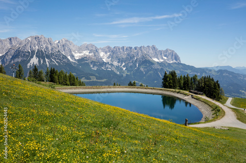 Scenic view of Hartkaiser lake against Kaiser Mountains, Tyrol, Austria photo