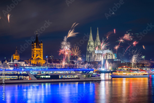 Germany, North Rhine-Westphalia, Cologne, Townhall, Gross Sankt Martin and Cologne Cathedral, New Year's Eve photo