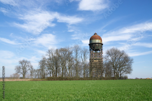 Germany, North Rhine-Westphalia, Ruhr, Grassy field with Lanstroper Ei water tower in background
