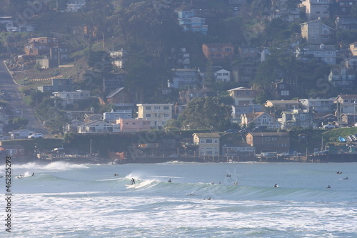 view of beach, houses and surfers at Pacifica Beach