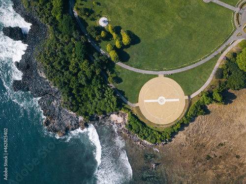 Indonesia, Bali, Nusa Dua, Aerial view of green lawn and coastal helipad