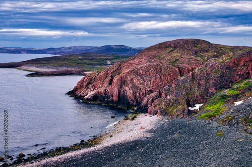 Cliffs and rocky beach of Barents Sea photo