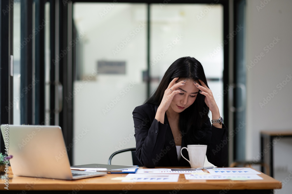 Beautiful asian businesswoman tired from work in the office, Woman feeling stress from work Beautiful asian businesswoman tired from work in the office, Woman feeling stress from work