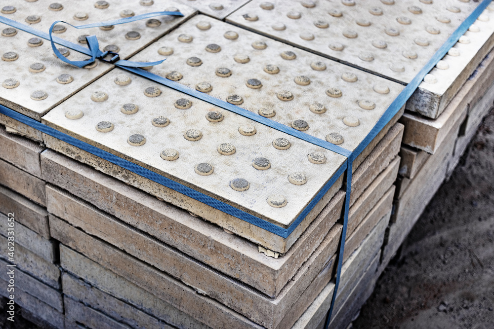 The tactile texture of paving slabs before being laid on the road. Protection of the blind on the sidewalk and walkways. The tactile texture of paving slabs before being laid on the road. Protection of the blind on the sidewalk and walkways.