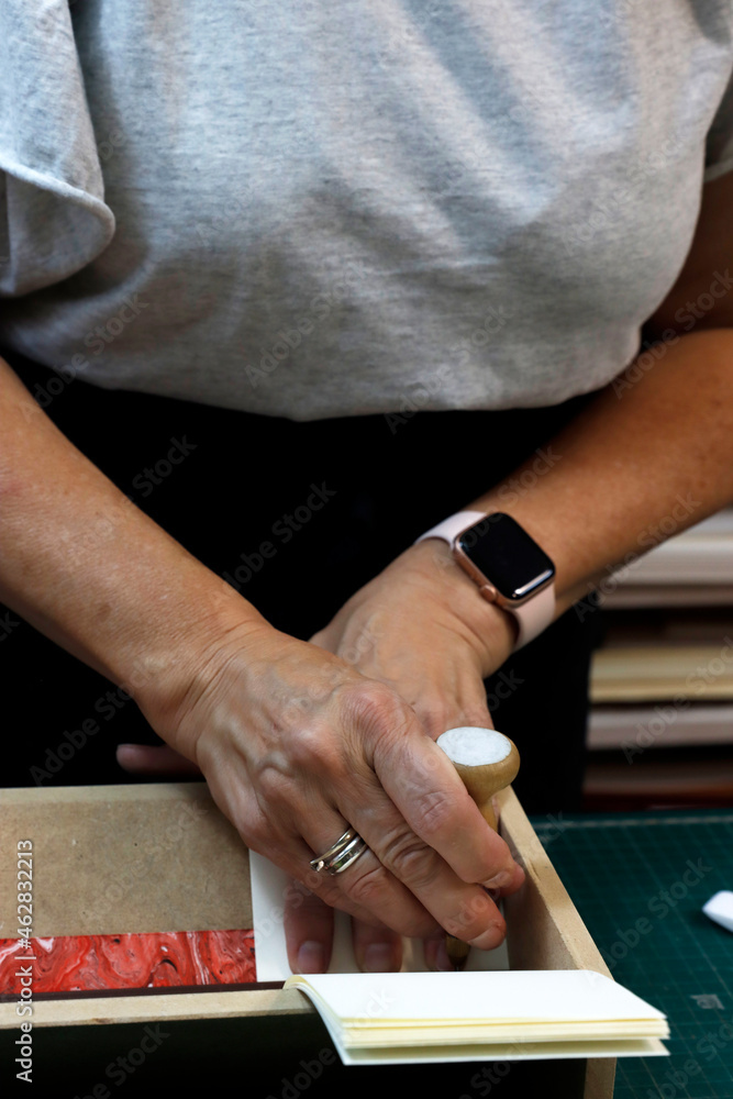 Working in a studio binding books Working in a studio binding books