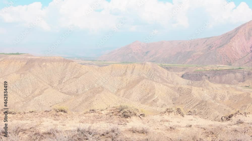 Man push bicycle touring in mountains. Solo travel journey with bicycle bags. Long-term travel around the world Man push bicycle touring in mountains. Solo travel journey with bicycle bags. Long-term travel around the world