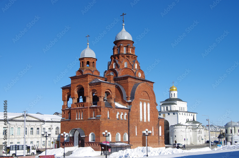 Vladimir, Russia - March, 2021: Ancient city street in winter sunny day. Trinity Church