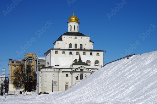 Vladimir, Russia - March, 2021: Ancient city street in winter sunny day. Golden Gate