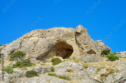 Mountain grotto Aeolian Harp on ecological trail Alchak-Kaya on Alchak Cape in Sudak, Crimea