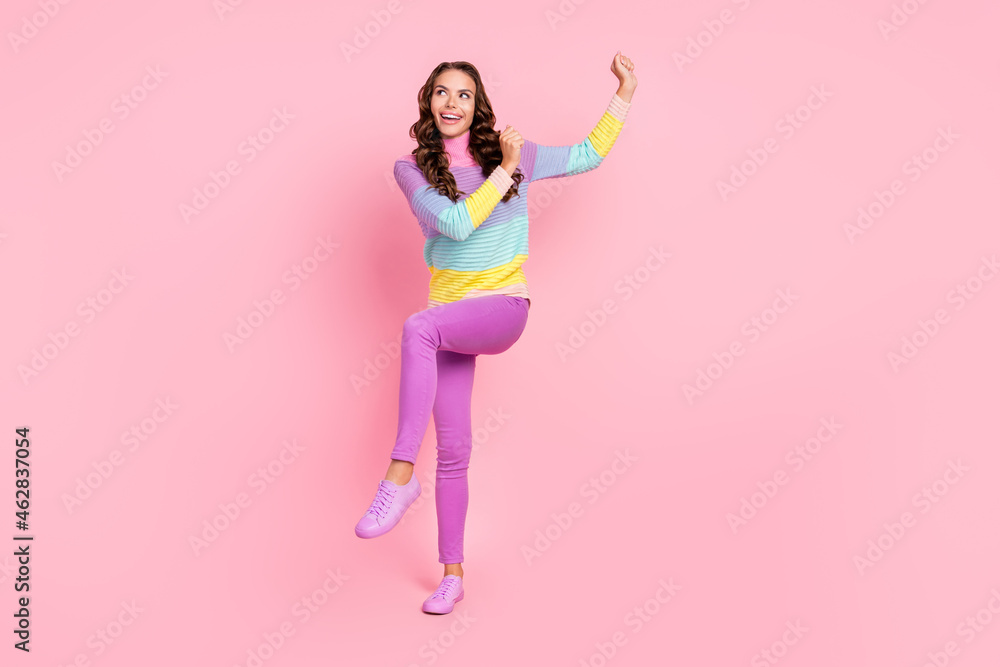Full size photo of young excited girl dancer clubber dream look empty space isolated over pastel color background