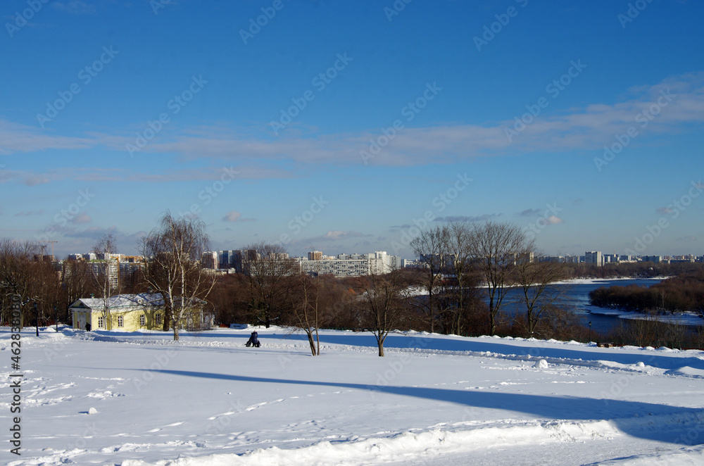 MOSCOW, RUSSIA - February, 2021: Winter day in the Kolomenskoye estate, top view to the Moscow river