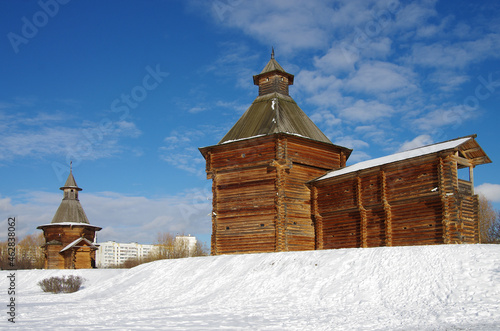 MOSCOW, RUSSIA - February, 2021: Winter day in the Kolomenskoye estate. Mokhovaya tower of Sumskoy stockaded fort with wooden wall photo