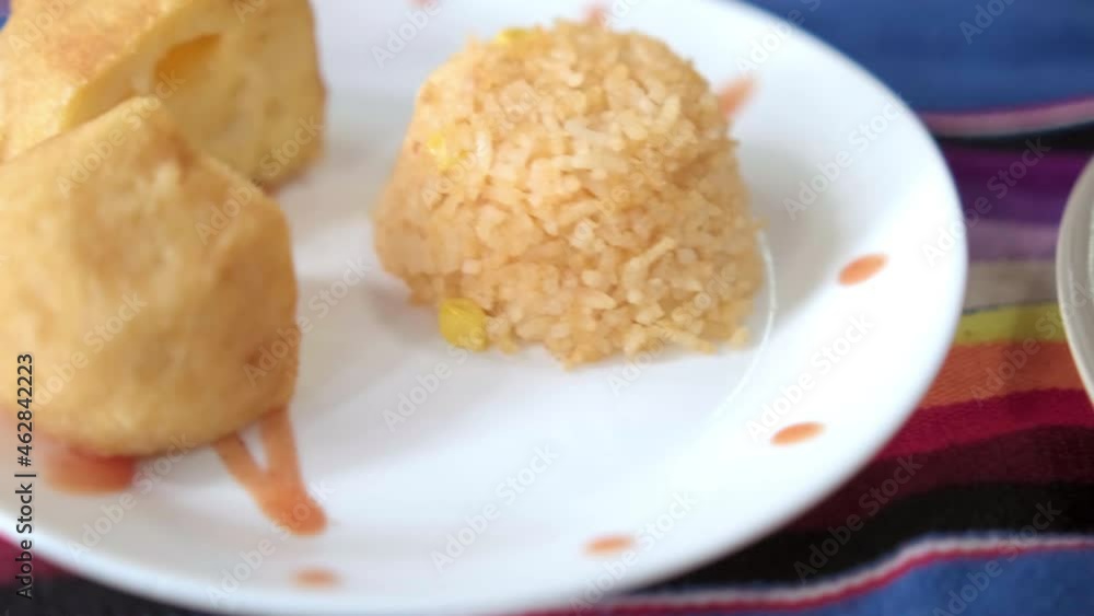 Three authentic delicious Mexican rice dishes on colorful tablecloth Three authentic delicious Mexican rice dishes on colorful tablecloth