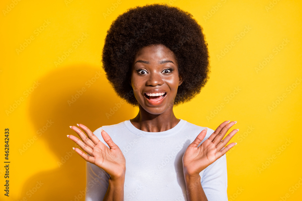 Portrait of impressed cute brunette short hair lady arms up wear white pullover isolated on vivid yellow color background Portrait of impressed cute brunette short hair lady arms up wear white pullover isolated on vivid yellow color background