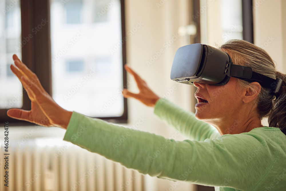 Woman using VR glasses at home Woman using VR glasses at home