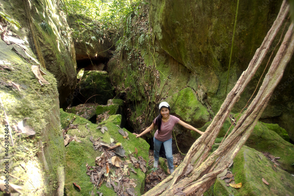 Malaysia, Borneo, Sabah, Kinabalu Park, woman in front of an flat cave Malaysia, Borneo, Sabah, Kinabalu Park, woman in front of an flat cave