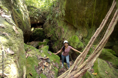 Malaysia, Borneo, Sabah, Kinabalu Park, woman in front of an flat cave photo