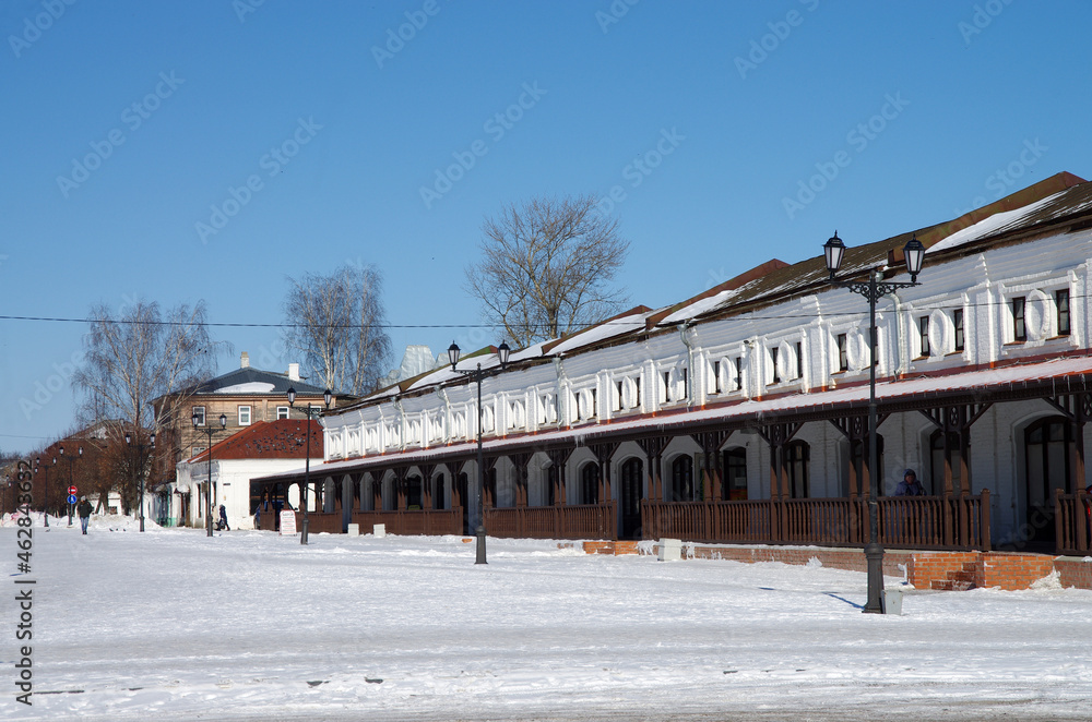 Yuryev-Polsky, Vladimir Oblast, Russia - March, 2021: Vladimirskaya street in winter sunny day