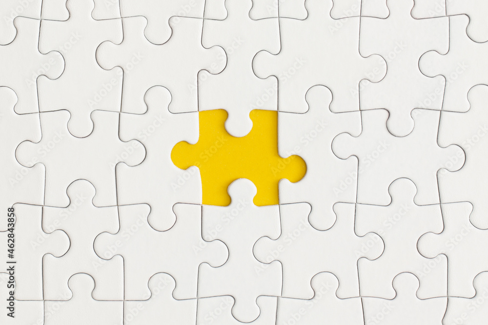 White details of puzzle on yellow background. Business strategy, teamwork. White details of puzzle on yellow background. Business strategy, teamwork.