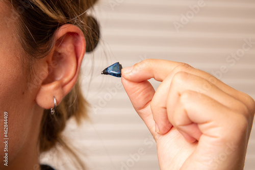 Tableau sur toile People with wireless hearing aids in the ear