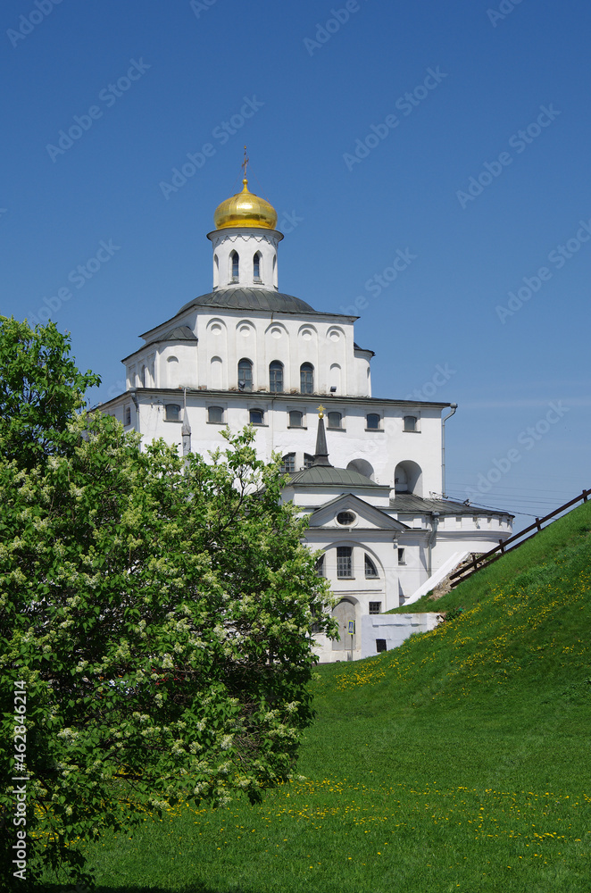 Vladimir, Russia - May, 2021:  Ancient city street in sunny day. Golden Gate