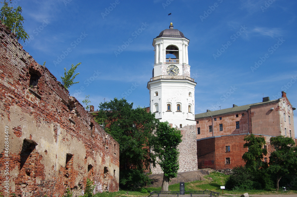 Vyborg, Russia - July, 2021: Clock Tower - a tower in Vyborg, the dominant feature of the Old Town, the former cathedral bell tower Vyborg, Russia - July, 2021: Clock Tower - a tower in Vyborg, the dominant feature of the Old Town, the former cathedral bell tower