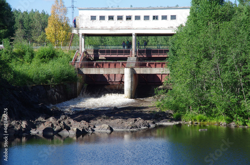 Girvas, Russia - July, 2021: Dam and waterfall on the Suna river photo