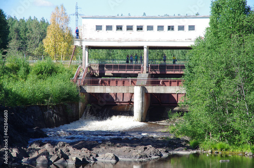 Girvas, Russia - July, 2021: Dam and waterfall on the Suna river photo