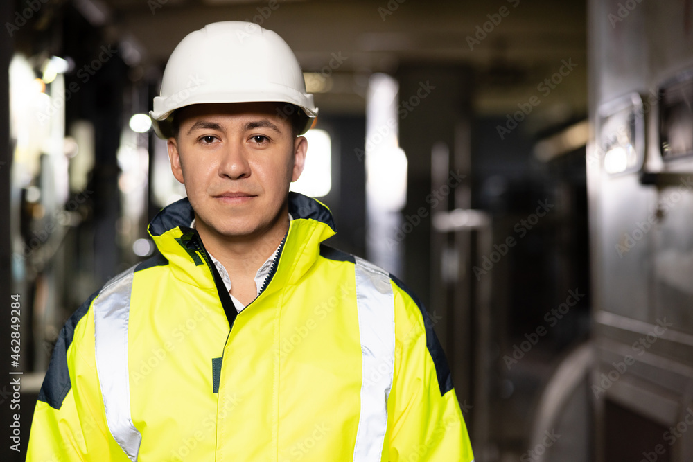 Caucasian Business People in Hard Hat or Safety Wear. Confident Contractor or Attractive Mechanic of Machine Inspection for Machinery Tool Job Close-up Indoors. Engineer Plan of Manufacture Work Caucasian Business People in Hard Hat or Safety Wear. Confident Contractor or Attractive Mechanic of Machine Inspection for Machinery Tool Job Close-up Indoors. Engineer Plan of Manufacture Work