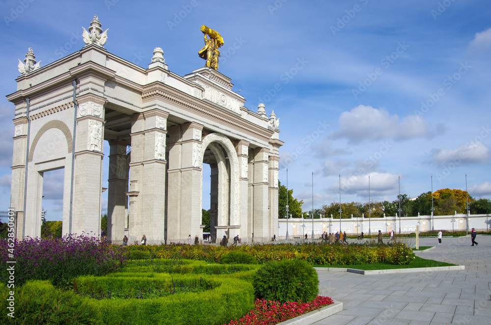 Moscow, Russia - September, 2021: Arch of the main entrance of VDNKh on a sunny autumn day