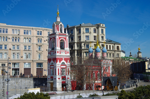 Moscow, Russia - March, 2021:  Bell tower and Church of St. George on Pskov hill in the landscape Park 