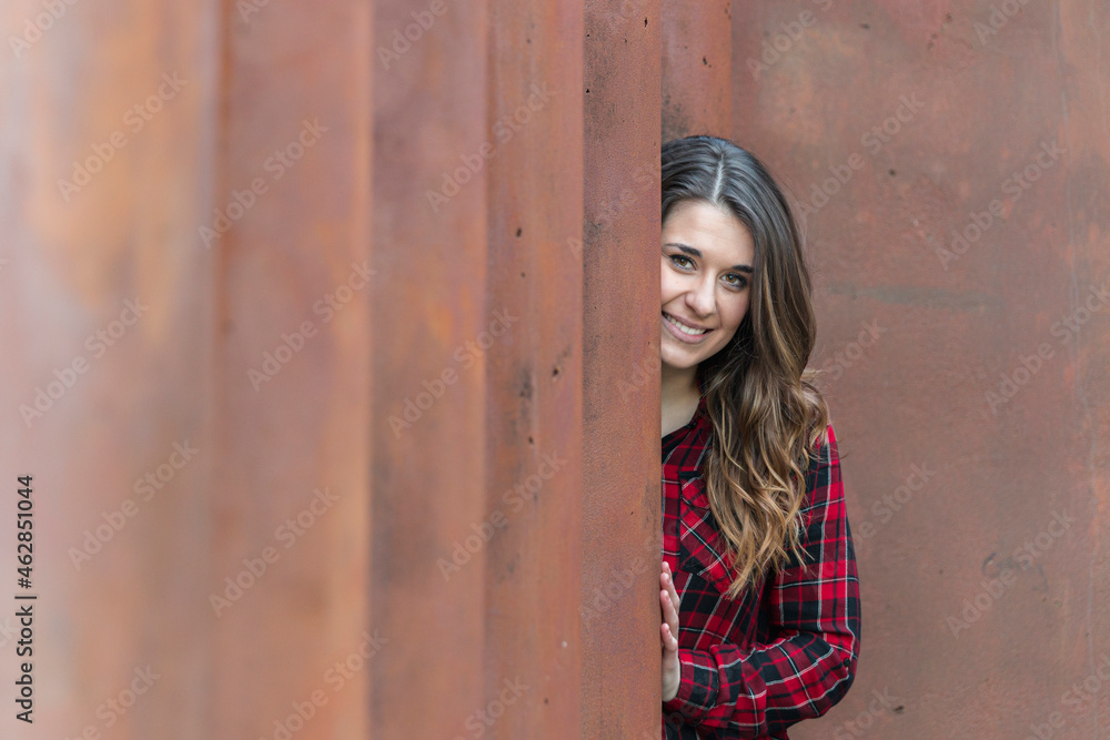 Portrait of smiling young woman wearing red plaid shirt Portrait of smiling young woman wearing red plaid shirt