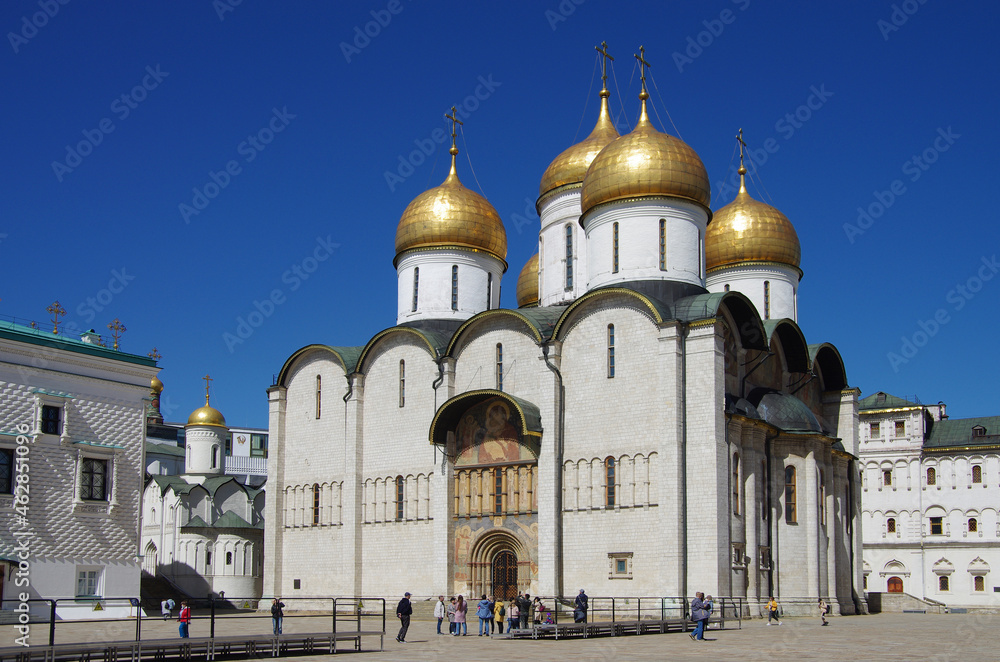 Moscow, Russia - May, 2021: Moscow kremlin inside in sunny spring day. Sobornaya Square and the Assumption Cathedral
